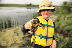 Young boy with bullfrog